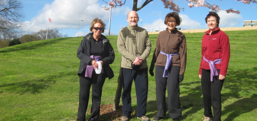 Image of 4 people over 50 under tree